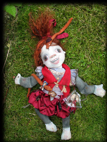 Molly the ghost doll in the grass